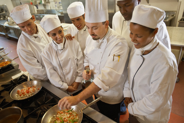 Chef Demonstrating to a Group of Students 